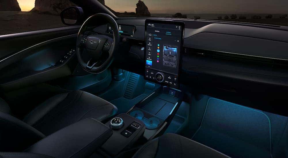 The black interior and lighting in a 2022 Ford Mustang Mach-E.