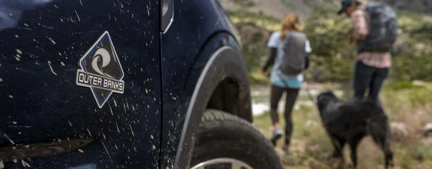 A close up shows the OuterBanks badge on a dark blue 2022 Ford Bronco Sport OuterBanks.