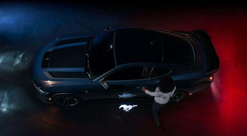 A black 2024 Ford Mustang Dark Horse is shown from an aerial view after visiting a Cincinnati Ford dealer.