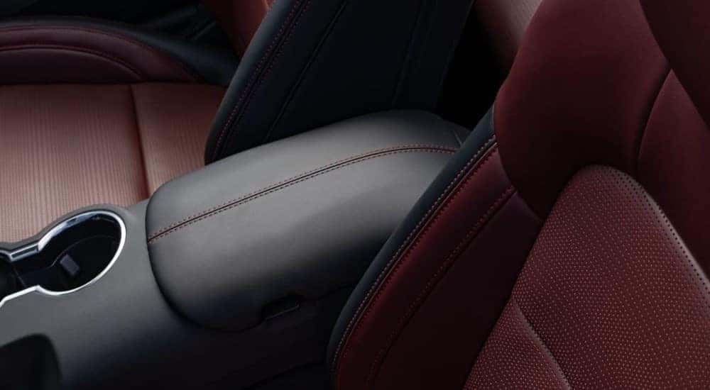The black and red interior of a 2024 Ford Mustang is shown.