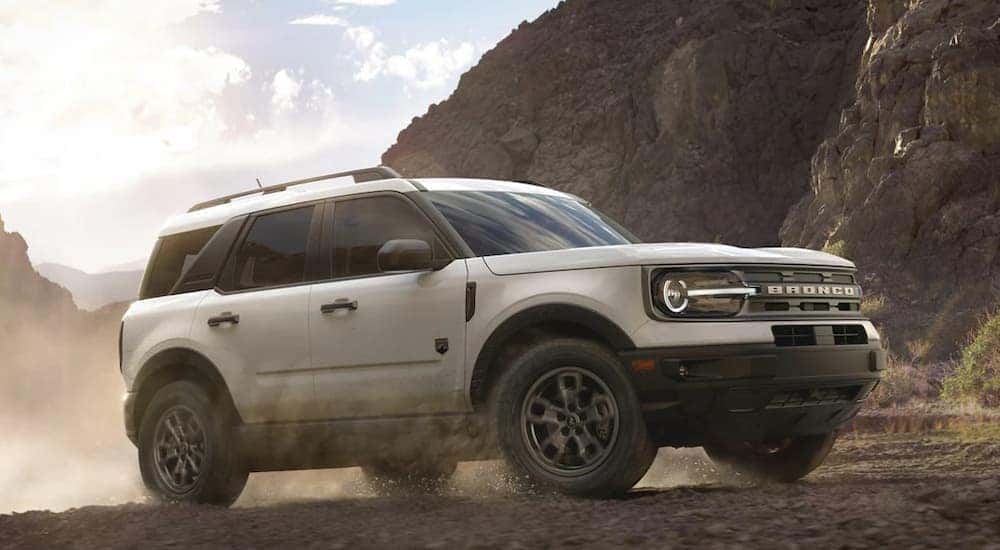 A white 2024 Ford Bronco Sport Big Bend is shown from the side while off-road.