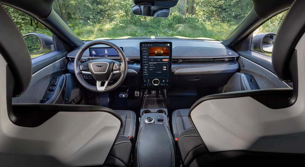 The grey interior of a 2024 Ford Mustang Mach-E Rally is shown from behind the front seats.