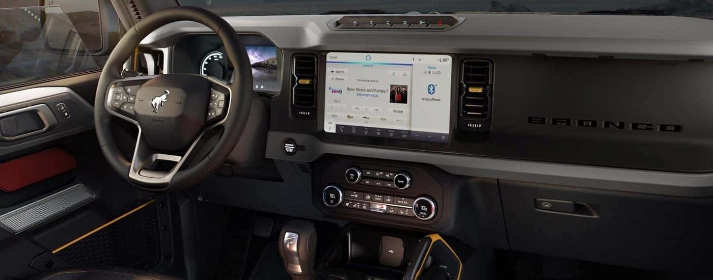 Yellow and red accents in the cabin of a 2024 Ford Bronco for sale.