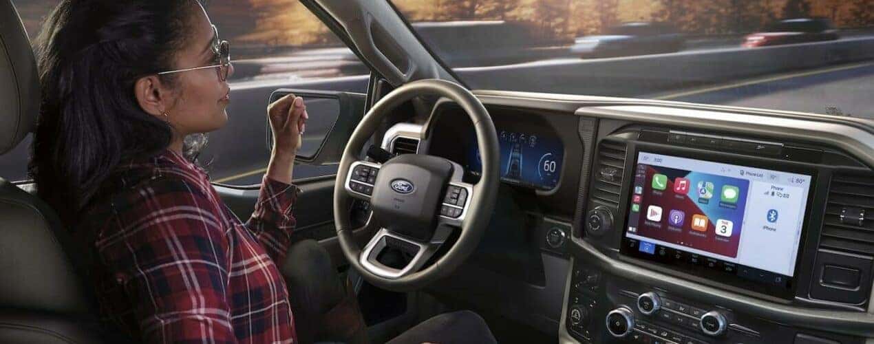 The black interior and dash in a 2024 Ford F-150 is shown.
