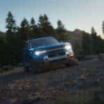 A blue 2025 Ford Bronco Sport Badlands is shown parked off-road.