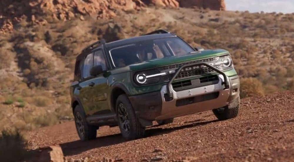 A green 2025 Ford Bronco Sport Badlands is shown off-roading.