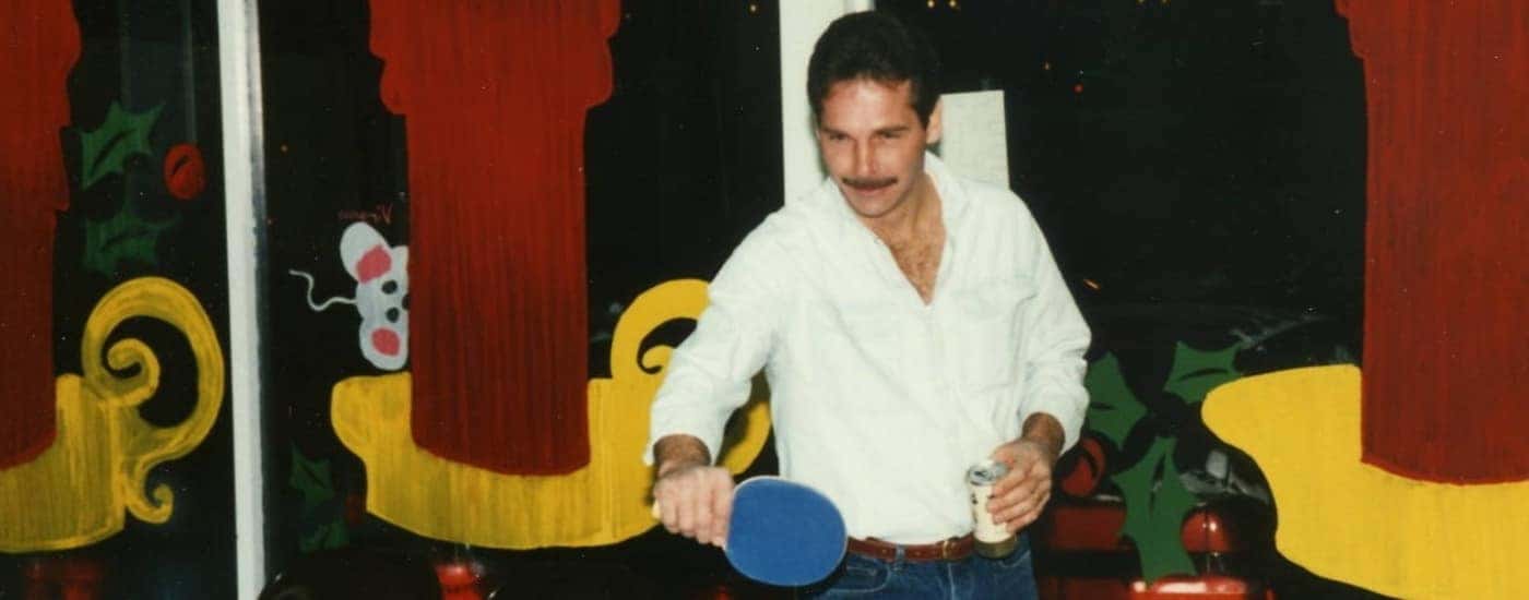 A person is shown playing ping pong at RS Ford.