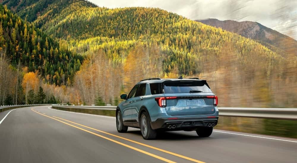 A blue 2025 Ford Explorer from the rear.