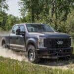 A gray 2025 Ford F-250 off-roading.