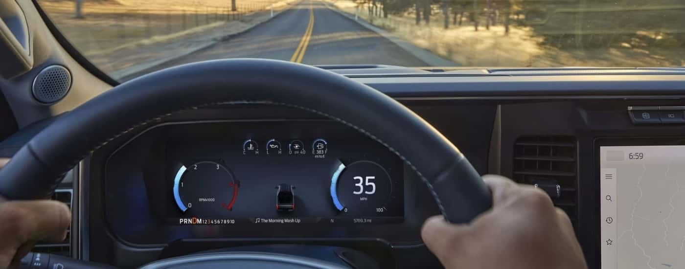 A close-up shows a digital gauge in a 2025 Ford F-250.