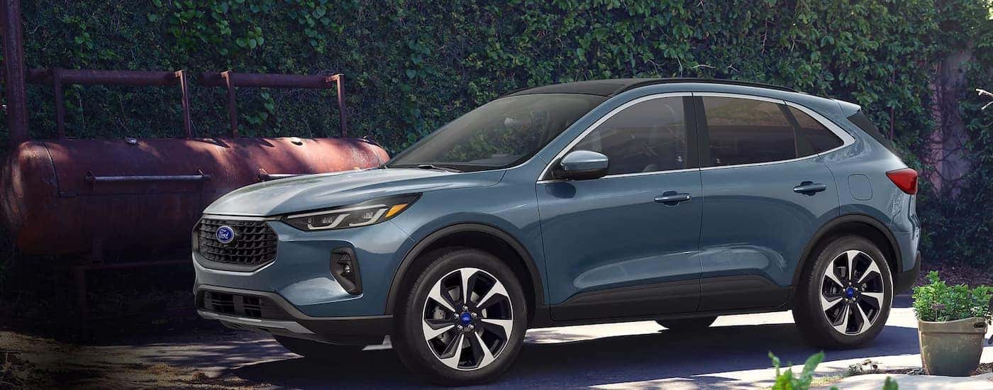 A blue 2025 Ford Escape parked in a driveway