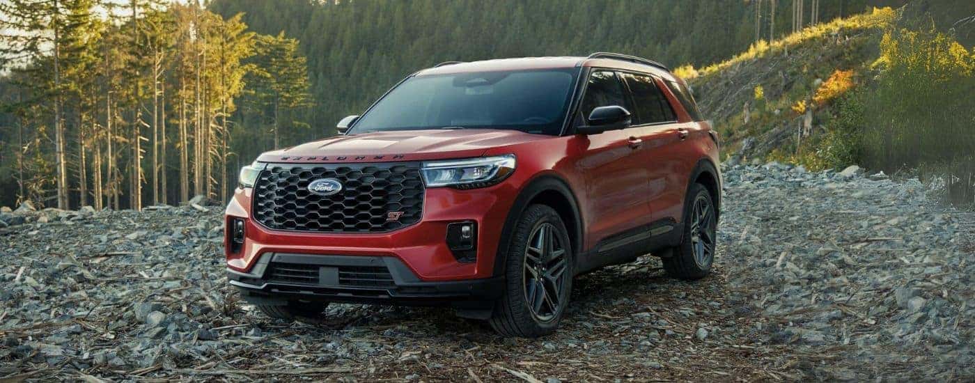 Red 2025 Ford Explorer ST parked off-road