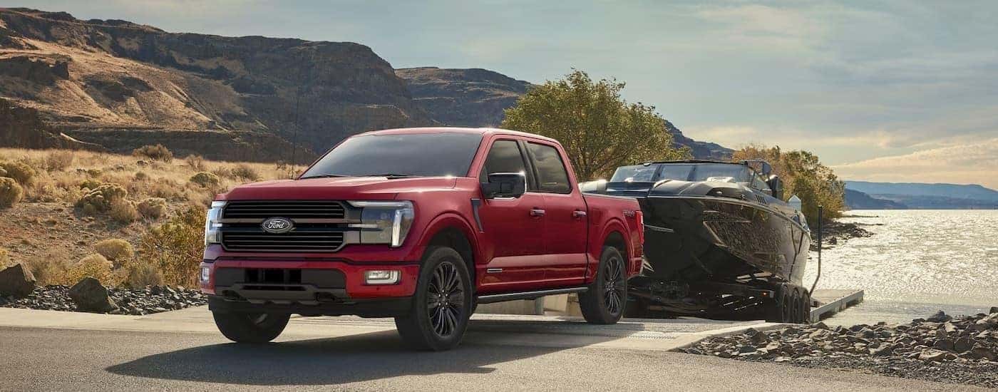 A red 2025 Ford F-150 for sale near Milford from the front