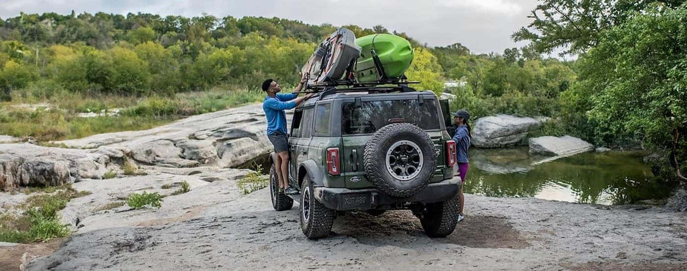 A green 2025 Ford Bronco parked off-road.