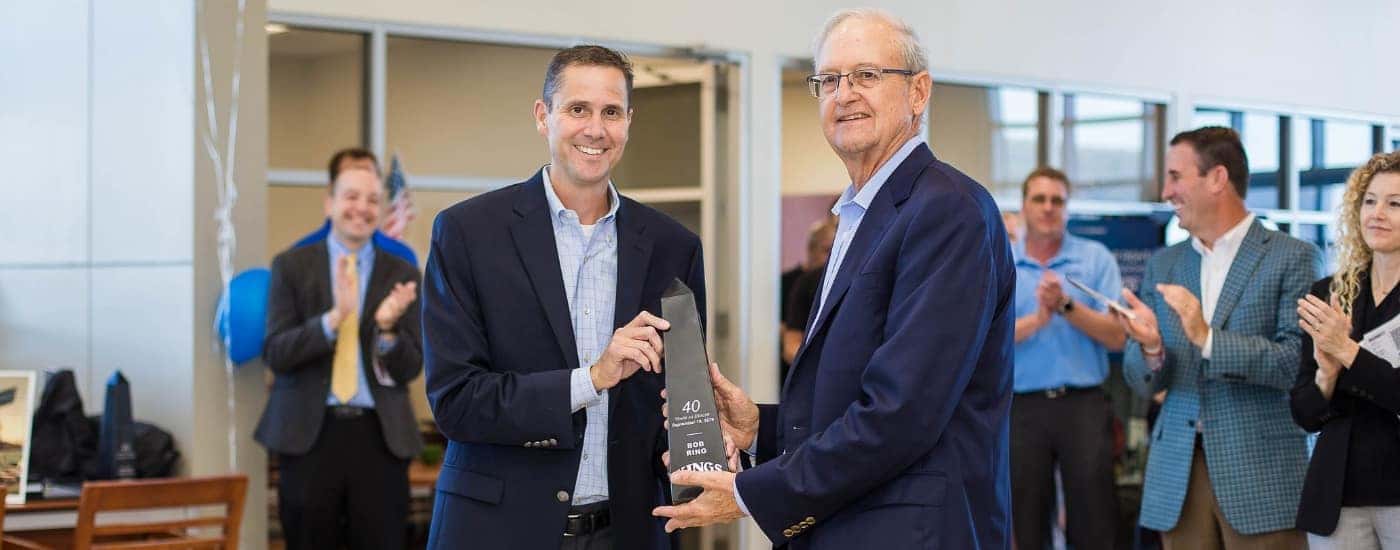 Bob Ring holding an award