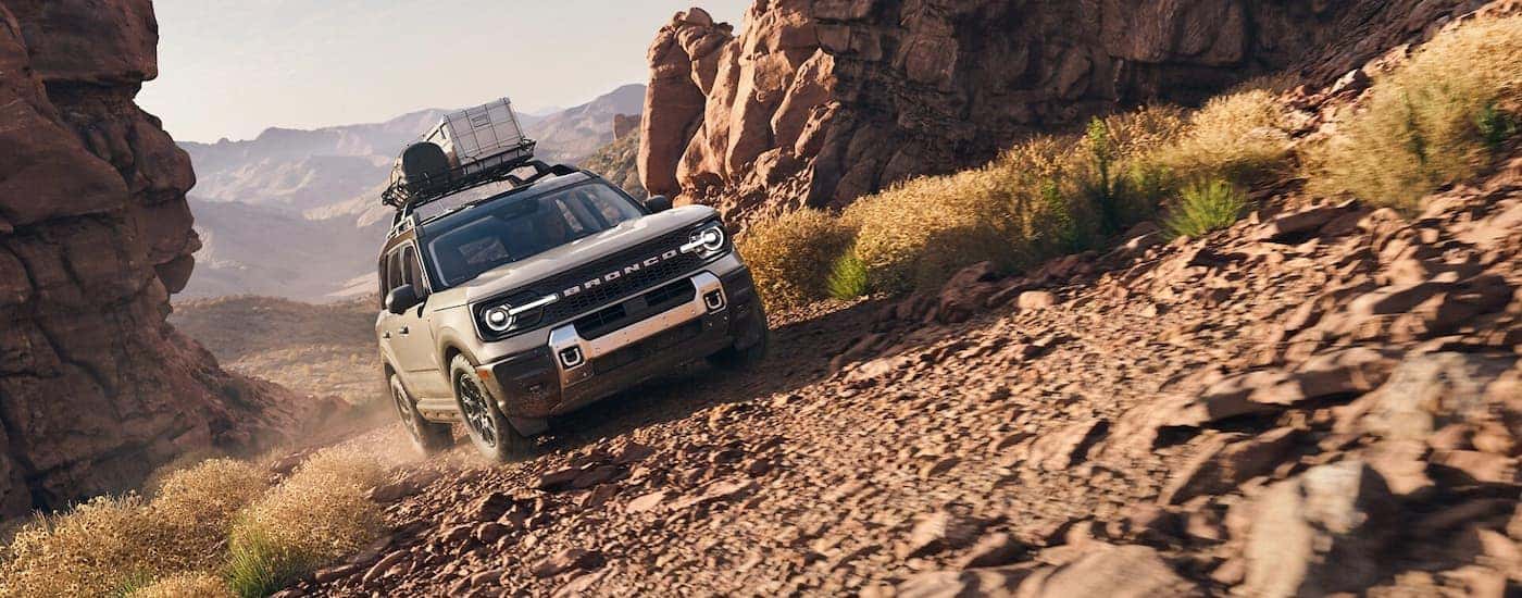 A gray 2025 Ford Bronco Sport off-roading on a rocky trail