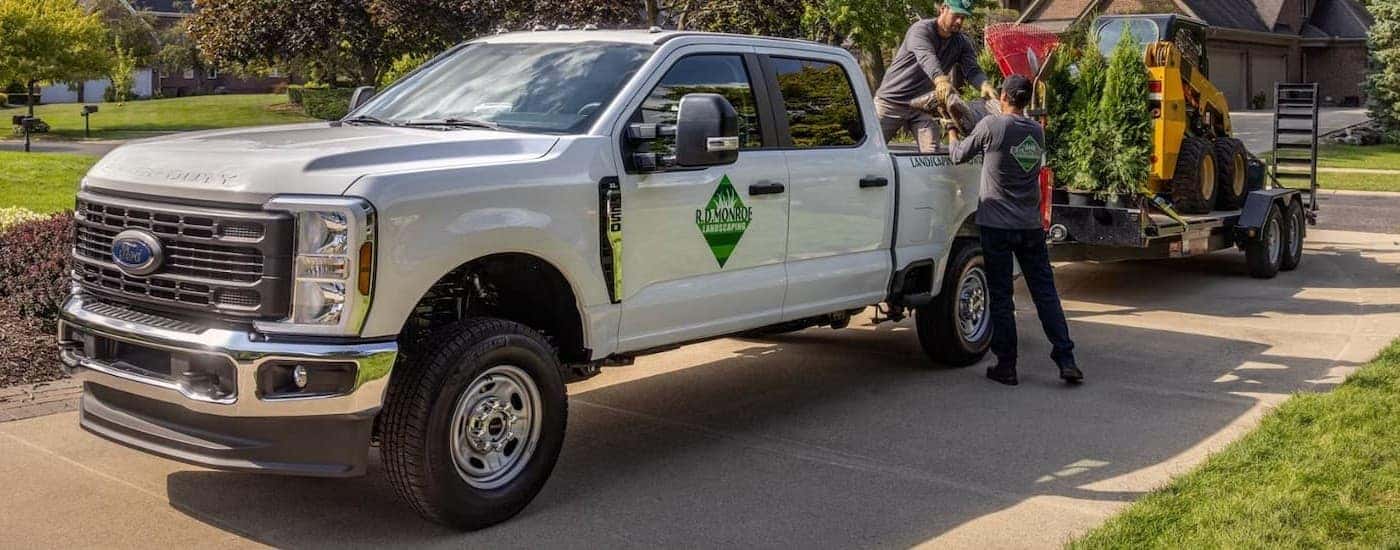 A white 2026 Ford F-250 parked while towing a trailer.
