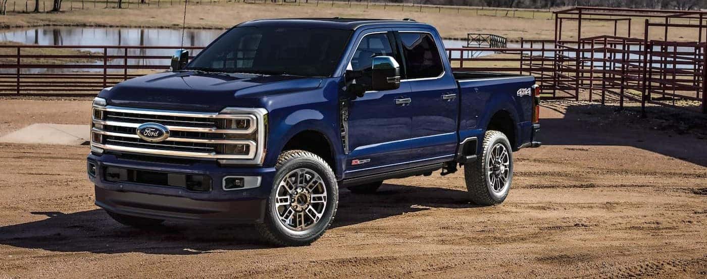 A blue 2026 Ford F-250 parked on a ranch.