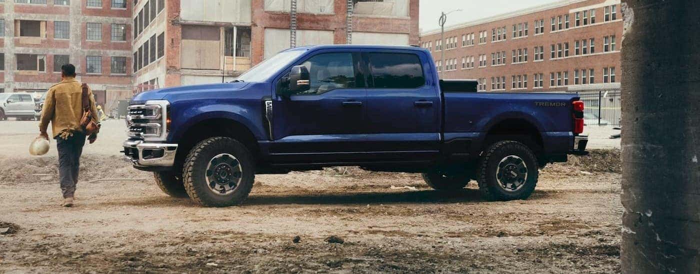 A blue 2026 Ford F-250 parked off-road after viewing a Ford Super Duty for sale.