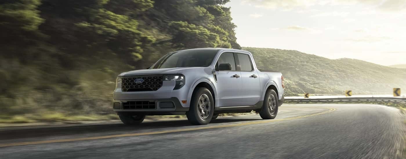 Grey 2025 Ford Maverick XLT rounding a corner