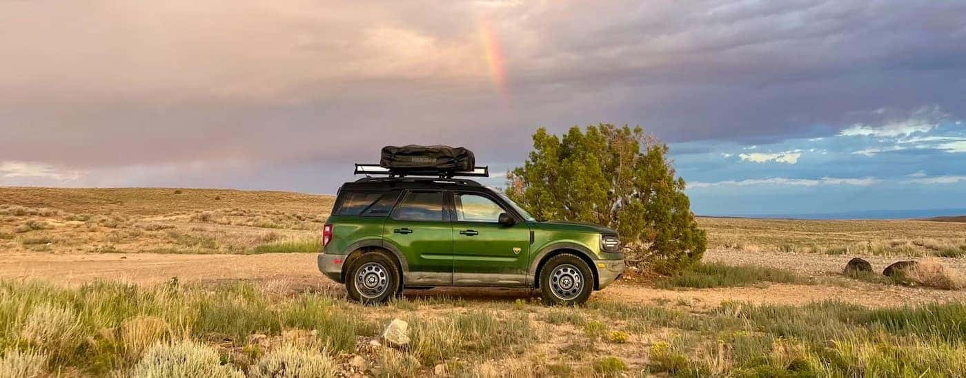 A green 2025 Ford Bronco Sport parked off-road.