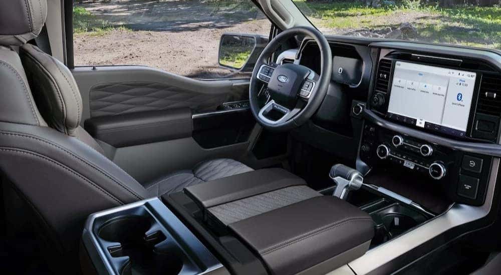 The multi-colored dash and interior in a 2026 Ford F-150 at a Ford dealer near Amelia.