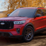 Red 2026 Ford Explorer ST parked by trees