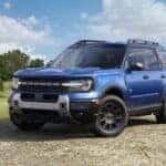 A blue 2026 Ford Bronco Sport parked off-road.