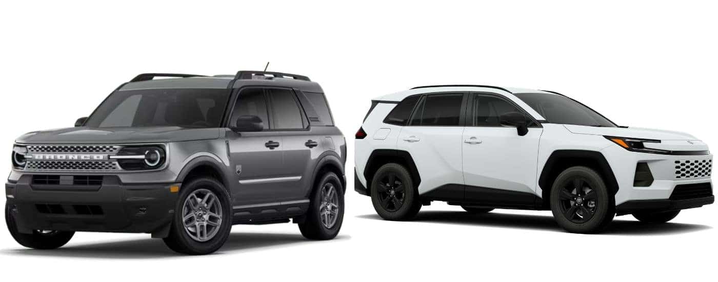 A gray 2026 Ford Bronco Sport vs a white 2026 Toyota RAV4
