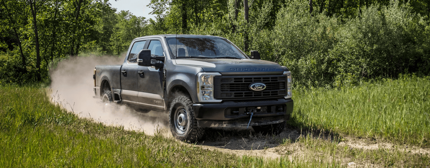 Grey 2026 Ford F-250 Super Duty for sale near Cincinnati driving on a dirt road