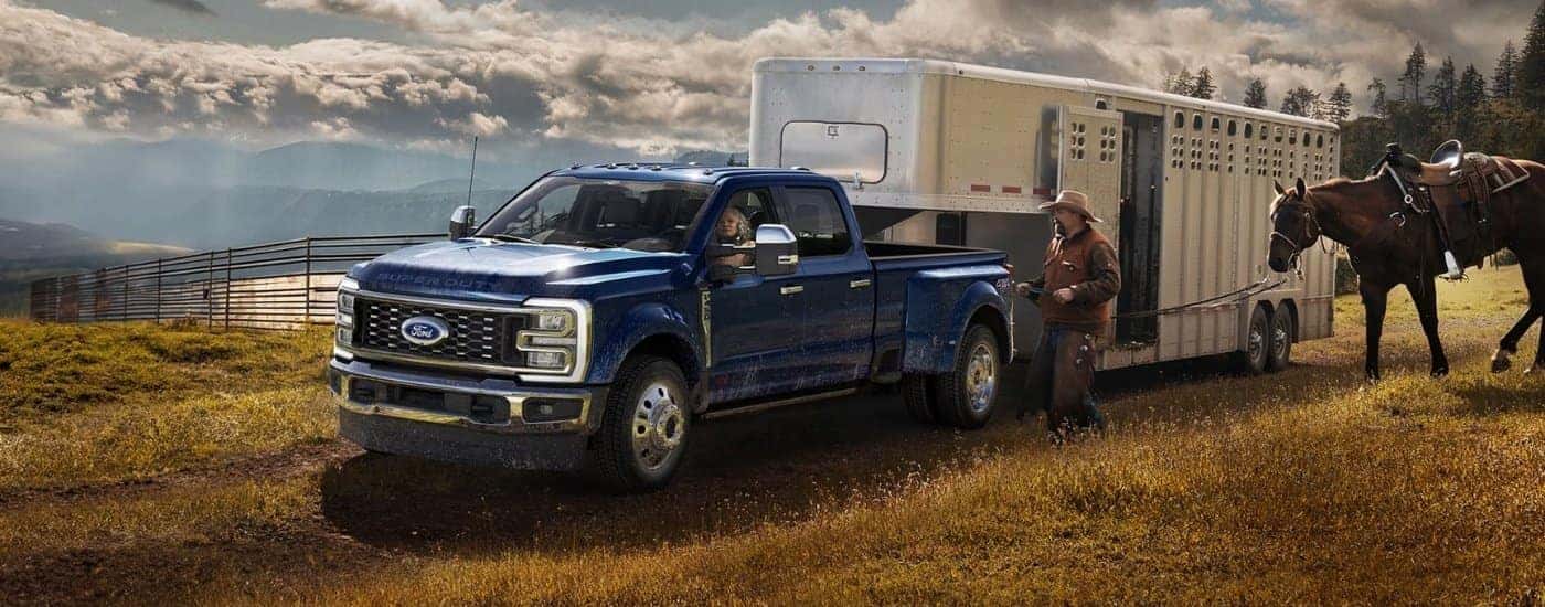 A blue 2026 Ford F-350 Super Duty for sale near Milford from the front at an angle.