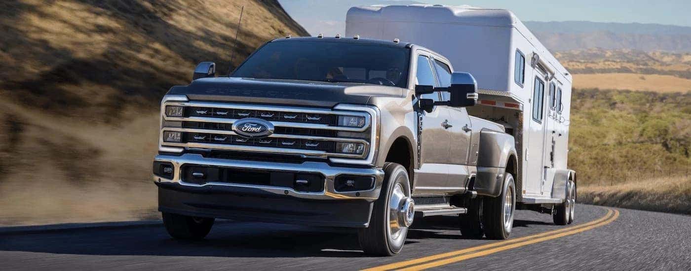 A grey 2026 ford F-350 from the front at an angle.