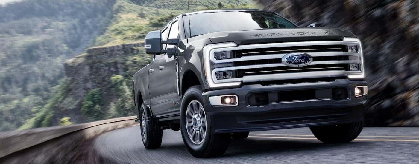 A black 2026 Ford Super Duty driving near Loveland
