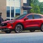 Red 2026 Ford Escape parked near a curb.