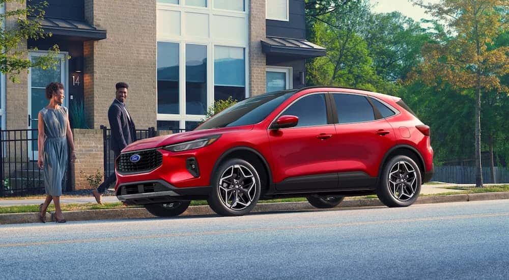 Red 2026 Ford Escape parked near a curb.