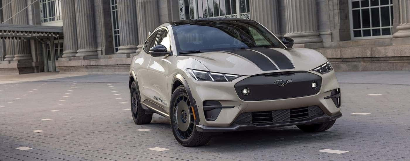 Beige and black 2025 Ford Mustang Mach-E Rally parked at an angle