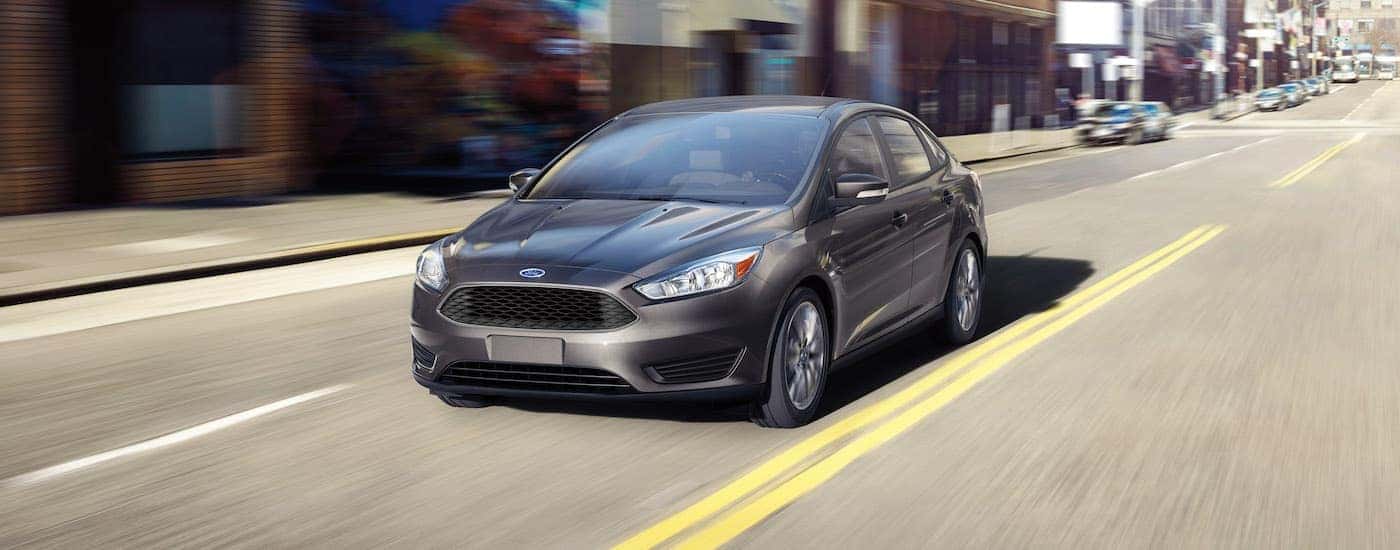 Grey 2016 Ford Focus driving down the road.