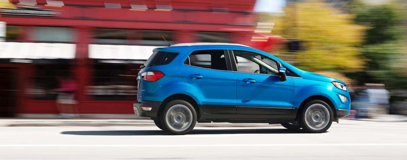 Blue 2018 Ford EcoSport driving down the road.