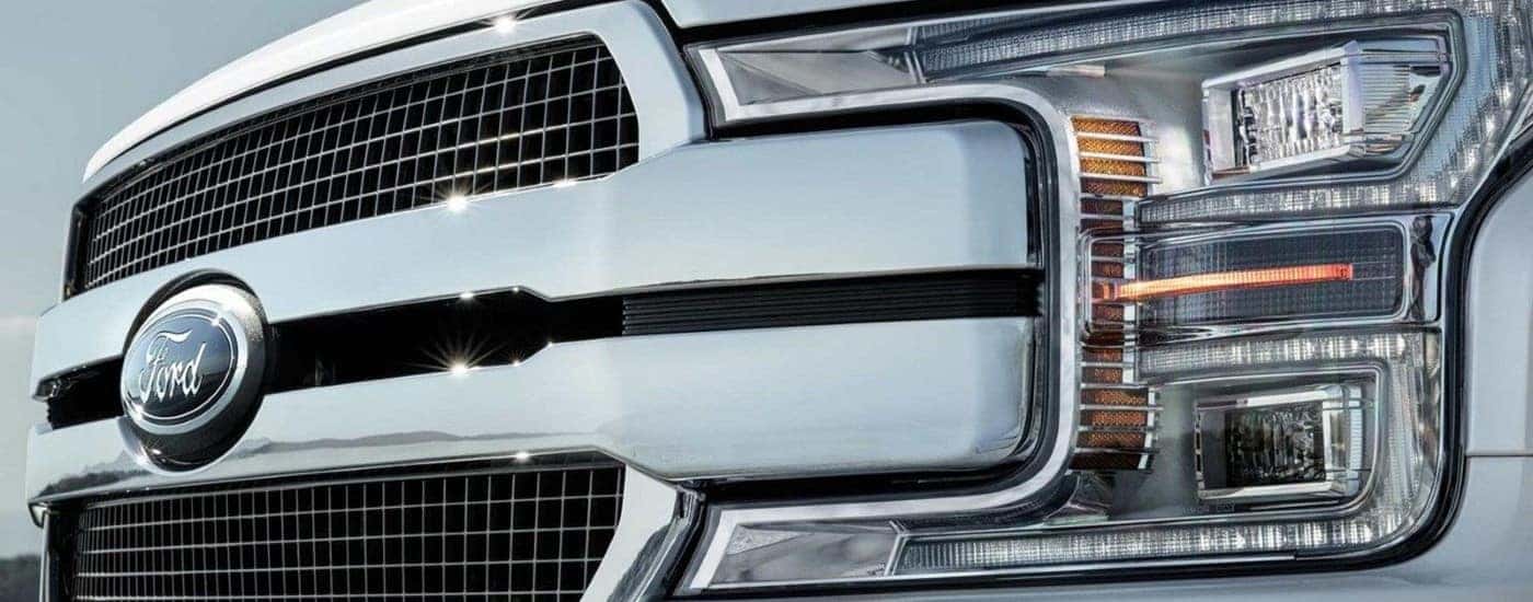 The grille of a white 2020 Ford F-150 is shown.