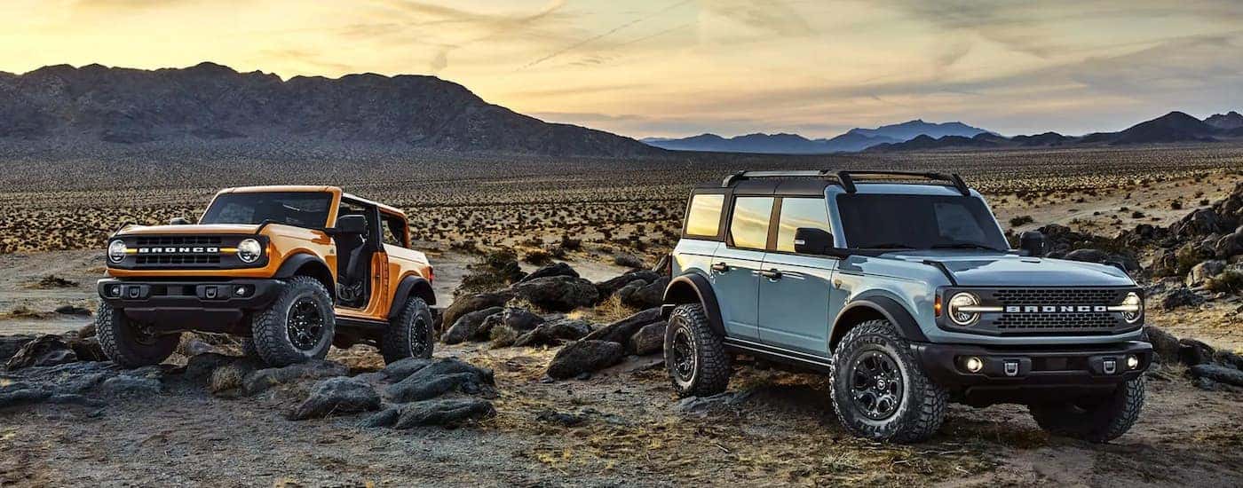 An orange and a blue 2021 Ford Bronco.