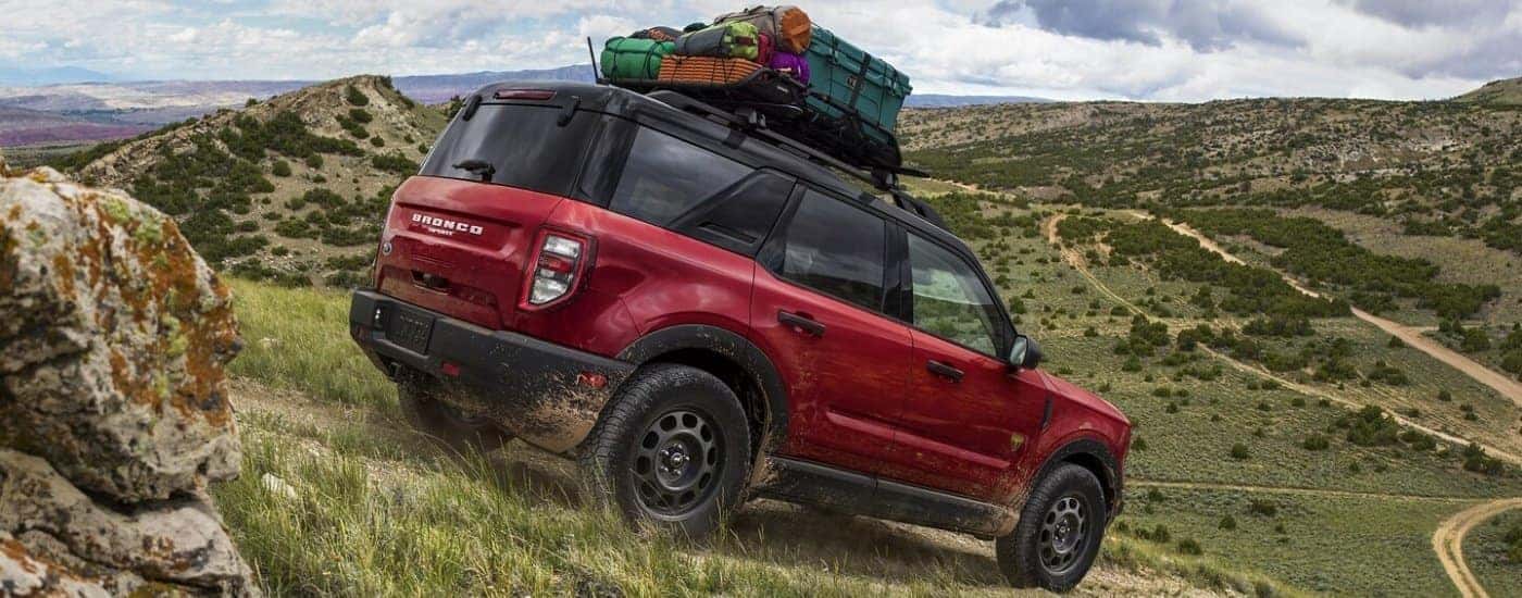 Red 2021 Ford Bronco Sport off-roading down a hill.