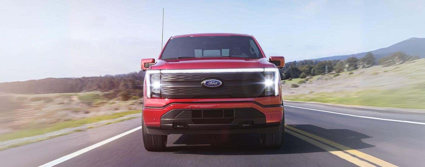 A red 2022 Ford Lightning is shown from the front.