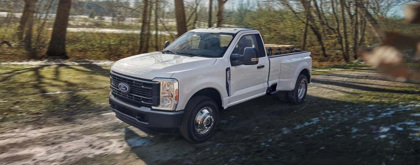 A 2023 Ford F-350 driving on a trail.