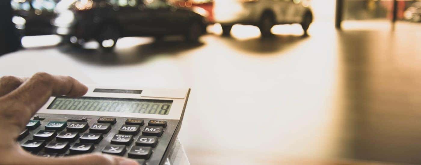 Calculating car payments at a dealership.