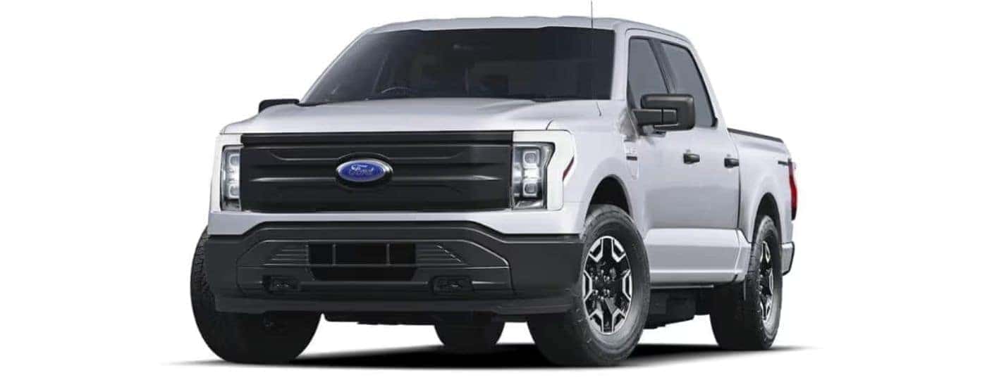 White 2022 Ford F-150 Lightning angled left.