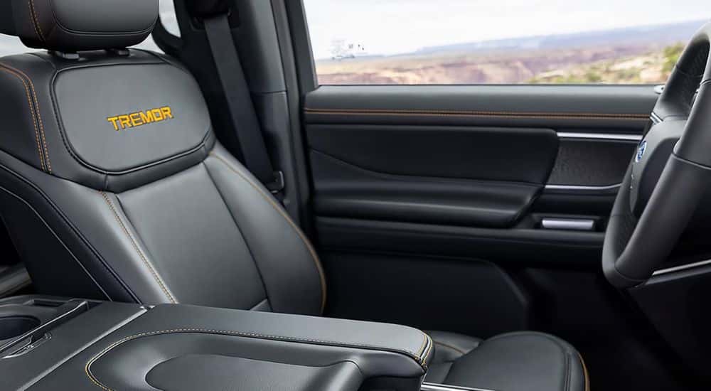 Driver seat and steering wheel shown in a 2027 Ford Expedition Tremor.