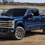 A blue 2025 Ford F-350 parked on a ranch.