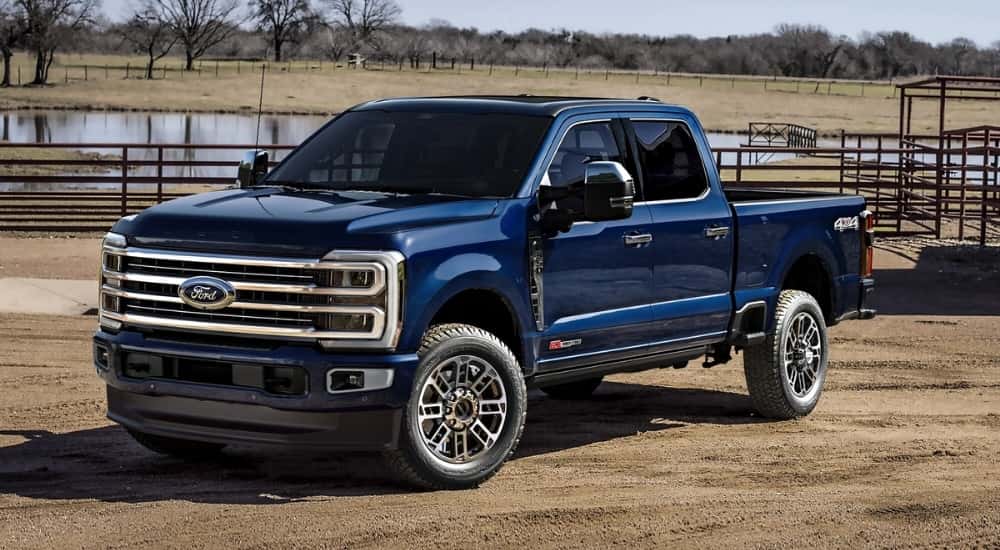 A blue 2025 Ford F-350 parked on a ranch.