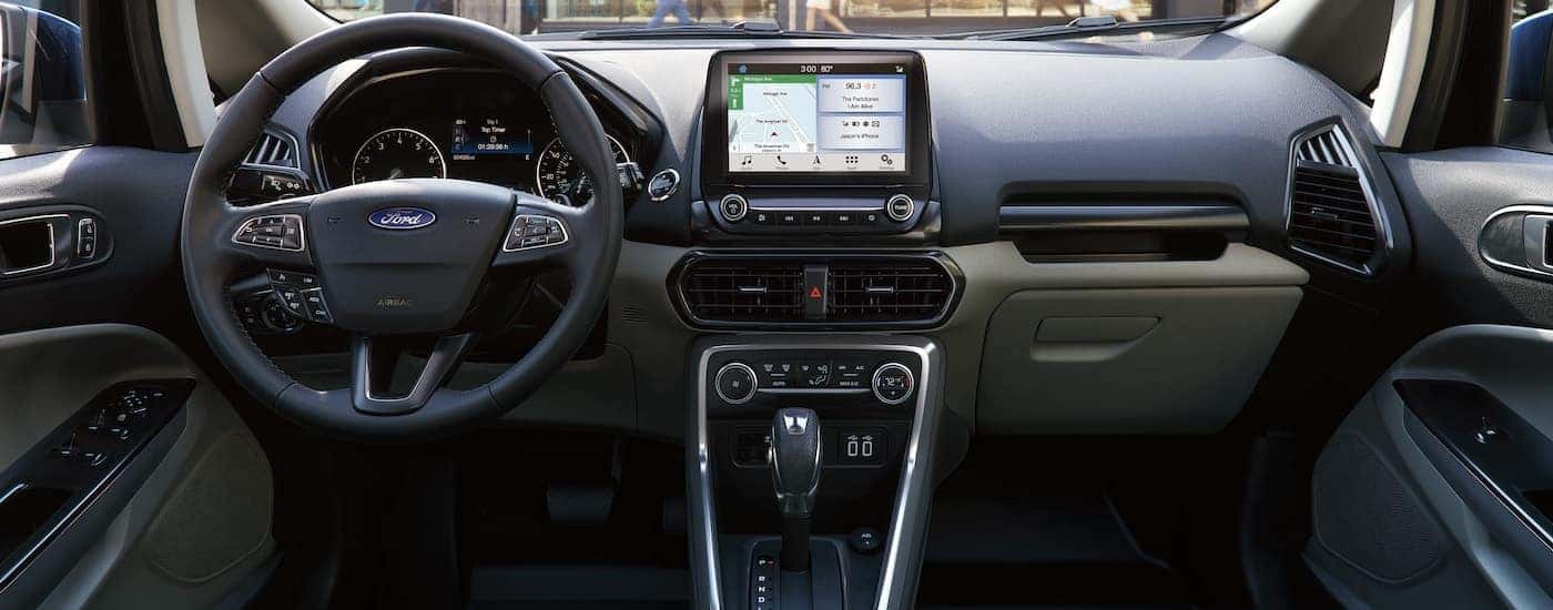 The front interior and dashboard showing infotainment on a 2018 Ford EcoSPort.