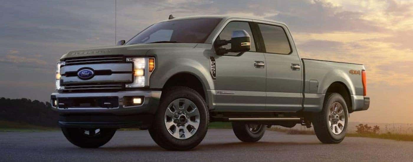 Grey 2019 Ford F-250 Super Duty parked in an open area at daybreak.